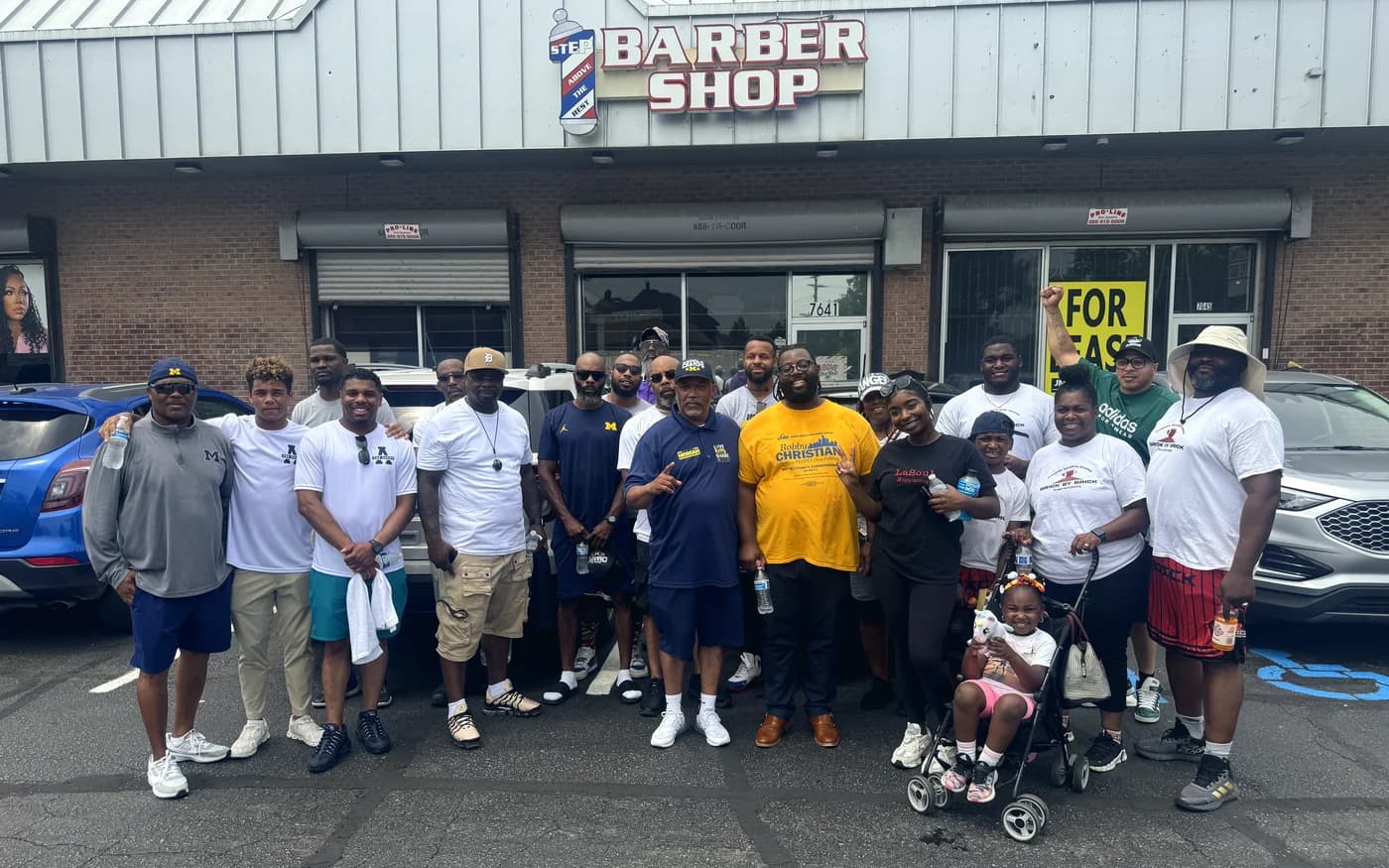 Bobby Christian with neighbours outside a Detroit barber shop