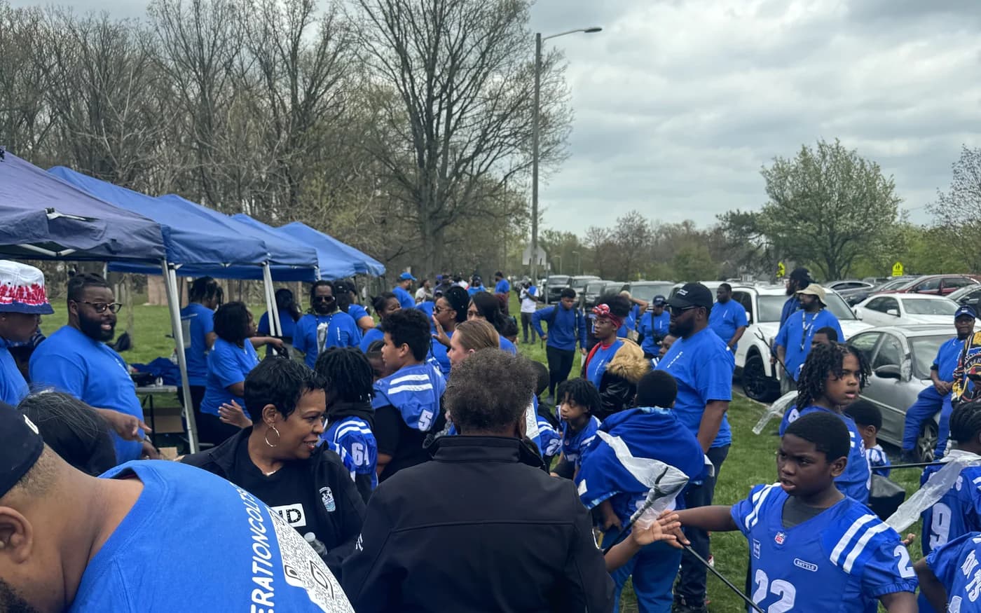 Volunteers and families at a neighbourhood cleanup day in Detroit
